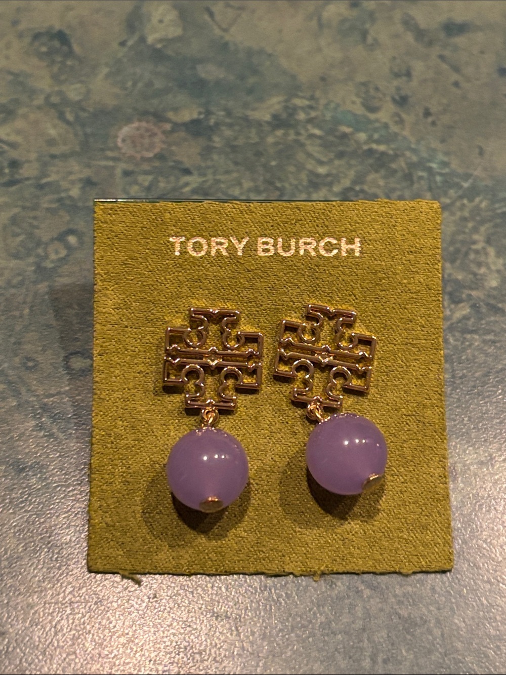 Brand new Tory Burch Gold plated Logo Drop Earrings with Lavender Spheres